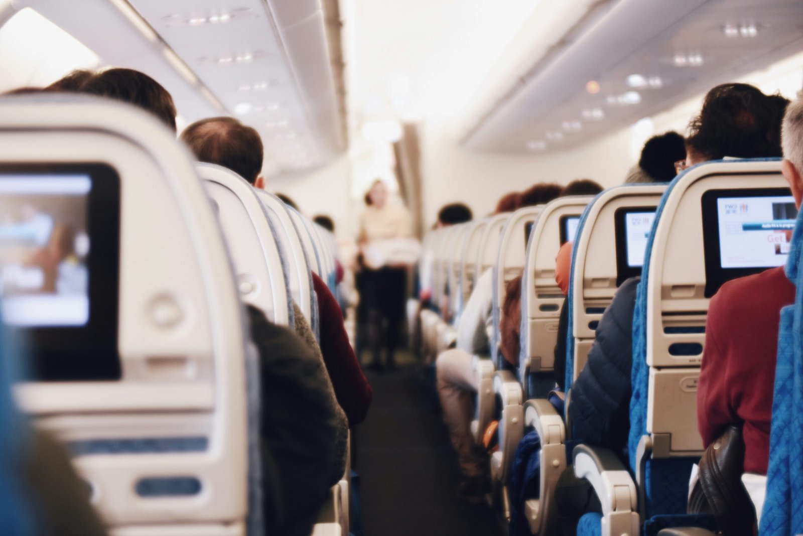 shallow focus photography of people inside of passenger plane